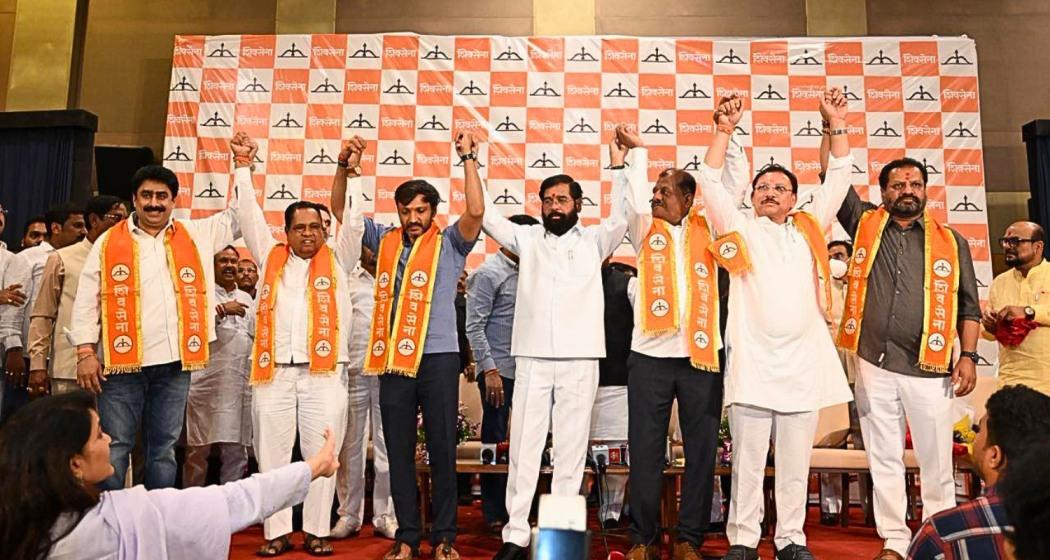 Maharashtra Deputy Chief Minister Eknath Shinde addresses a gathering alongside six rebel Shiv Sena (UBT) Lok Sabha MPs after they joined the Shiv Sena faction led by him, at Yashwantrao Chavan Pratishthan in Mumbai on Monday.
