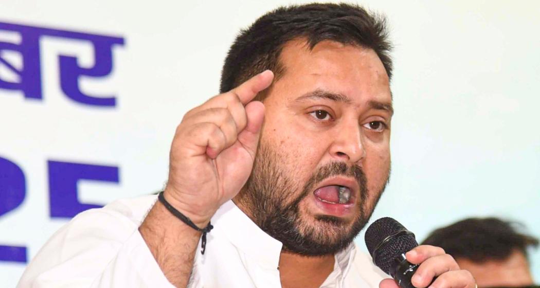 RJD leader and former deputy chief minister Tejashwi Yadav addresses supporters during a press conference in Bihar.