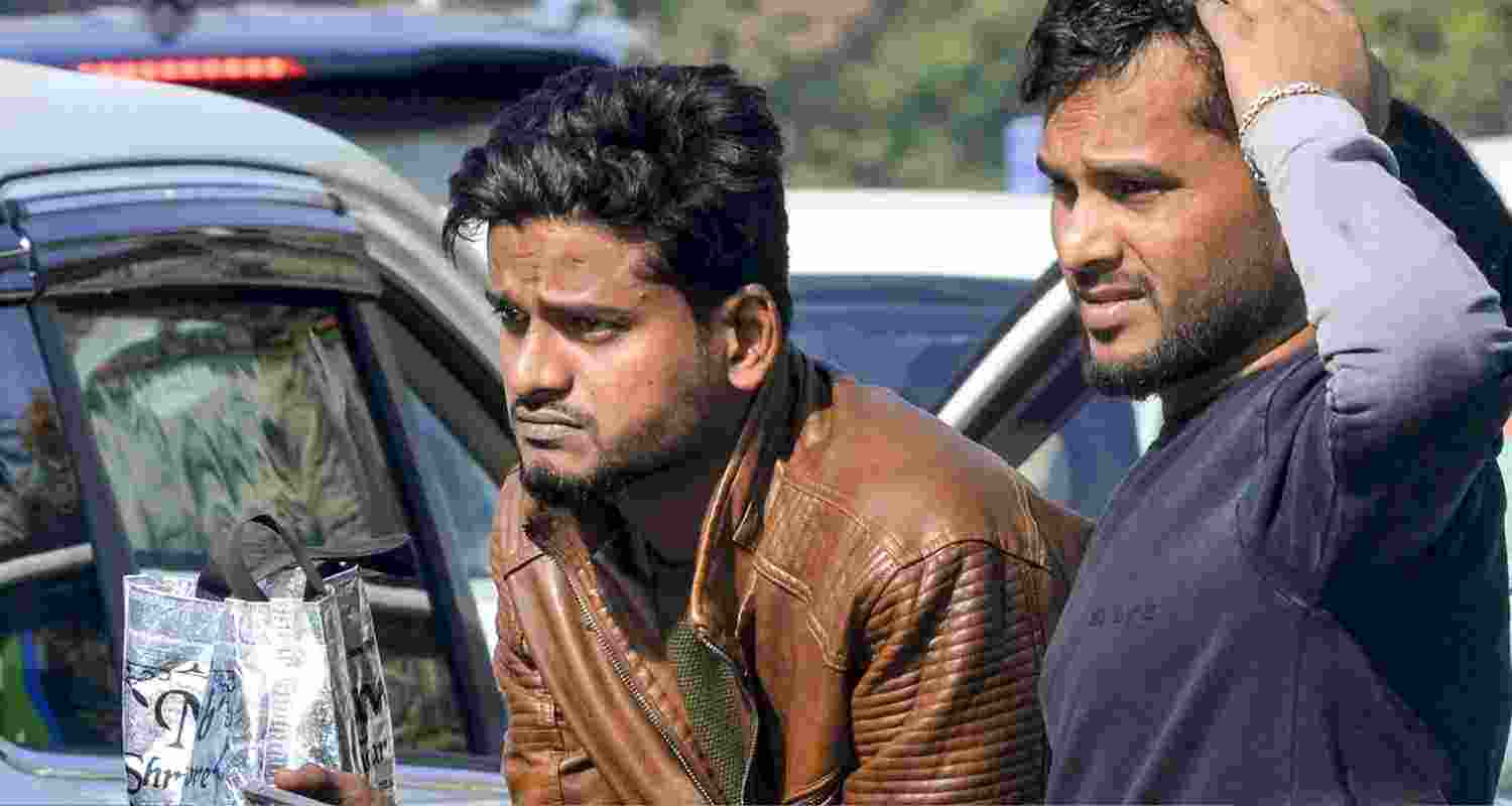 Passengers wait outside the Birsa Munda International Airport, in Ranchi, Saturday, Dec. 6, 2025. Domestic carrier IndiGo has cancelled over 400 flights from four major airports on Saturday, a day after managing to temporarily secure major relaxations in the second phase of the court-mandated new flight duty and rest period norms for the cockpit crew, sources said.