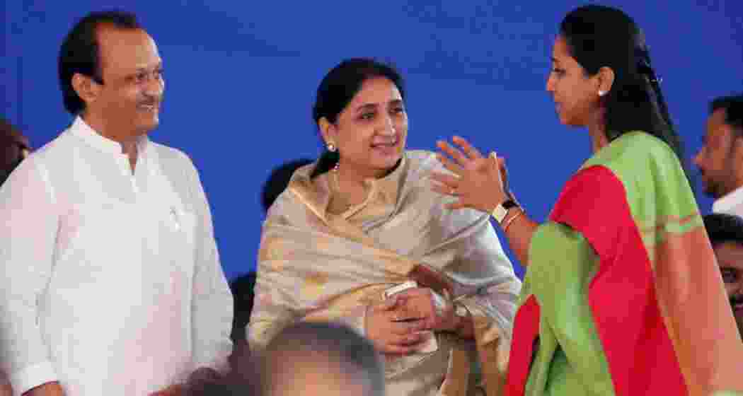 Ajit Pawar and Sunetra Pawar share a moment with NCP leader Supriya Sule during a public interaction in Maharashtra.
