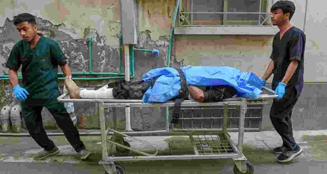 Paramedics shift an injured man at a hospital in Quetta following an attack by Baloch separatists.