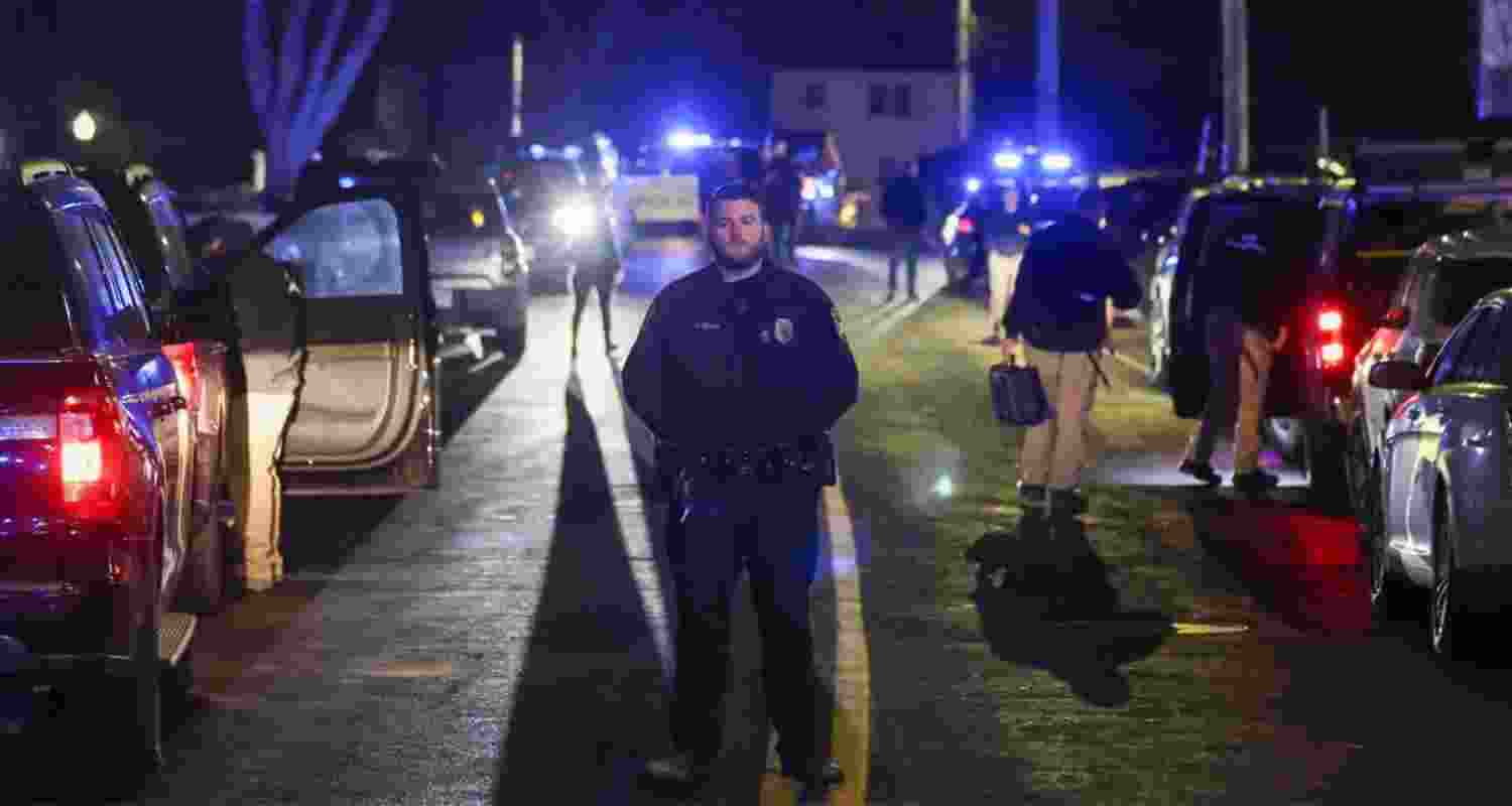 Law enforcement officers are seen outside a storage facility where a suspect in the shooting at Brown University was found dead.