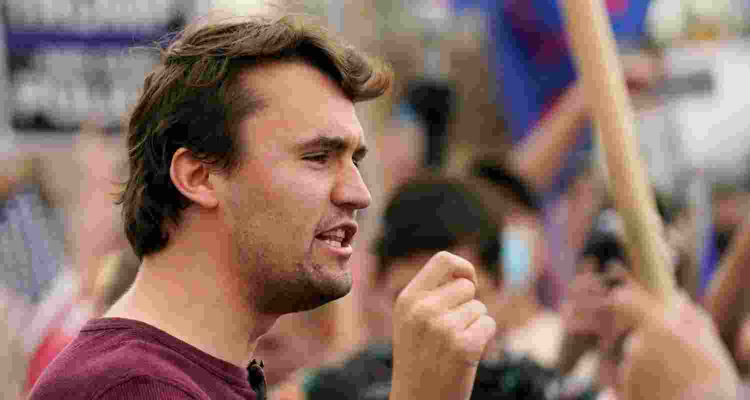 Charlie Kirk, conservative activist and founder of Turning Point USA, speaks to supporters of President Donald Trump at a rally outside the Maricopa County Recorder's Office, Friday.