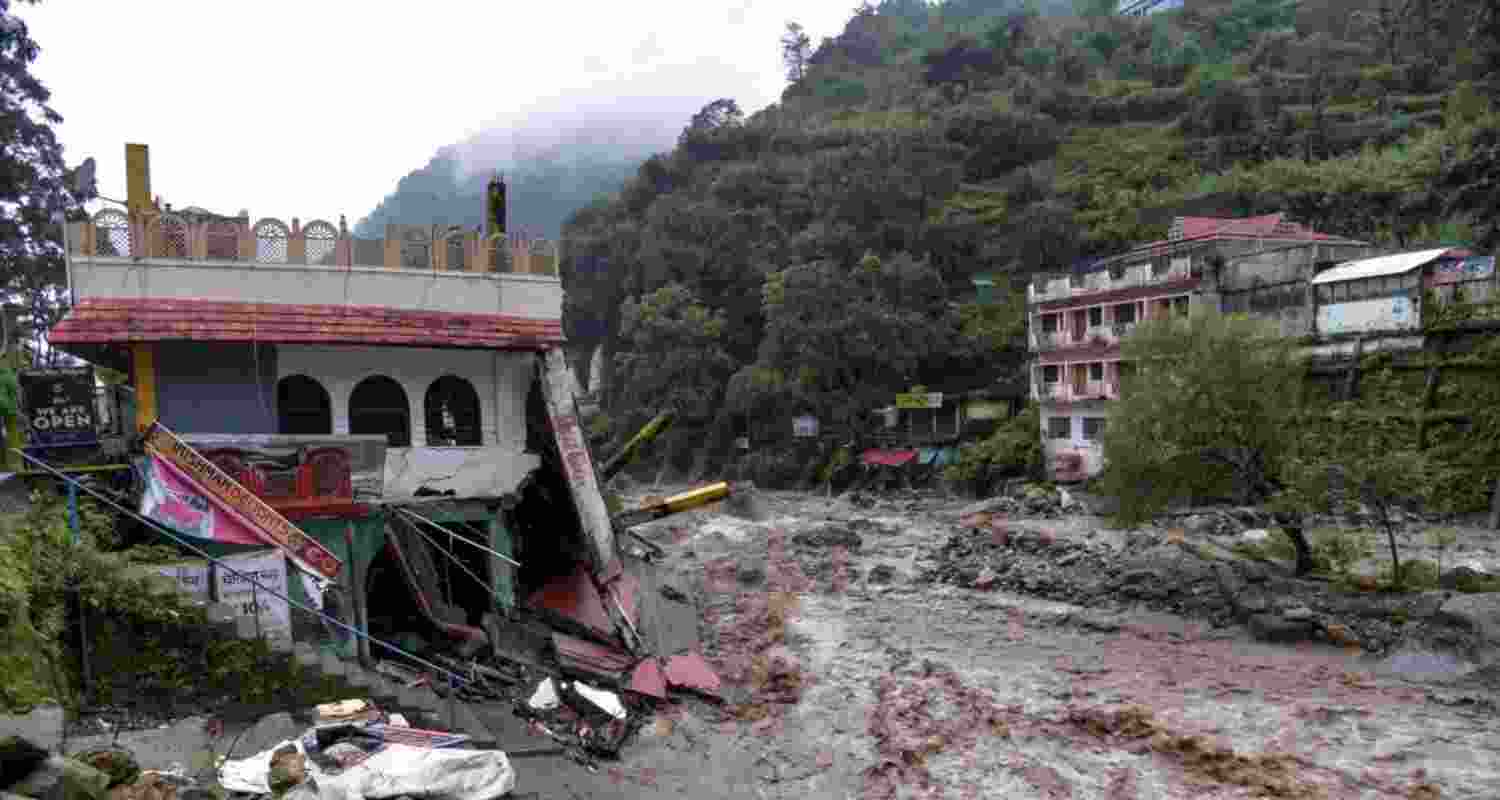A house near the river lies in ruins after a downpour triggered a cloudburst and landslides, at Sahastradhara, in Dehradun on Tuesday.
