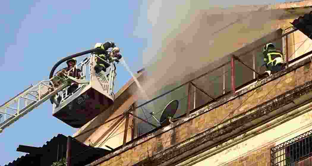 Firefighters at the scene after a fire broke out at the Enforcement Directorate office building in South Mumbai's Ballard Estate early on Sunday. No casualties were reported. (Screengrab/X)