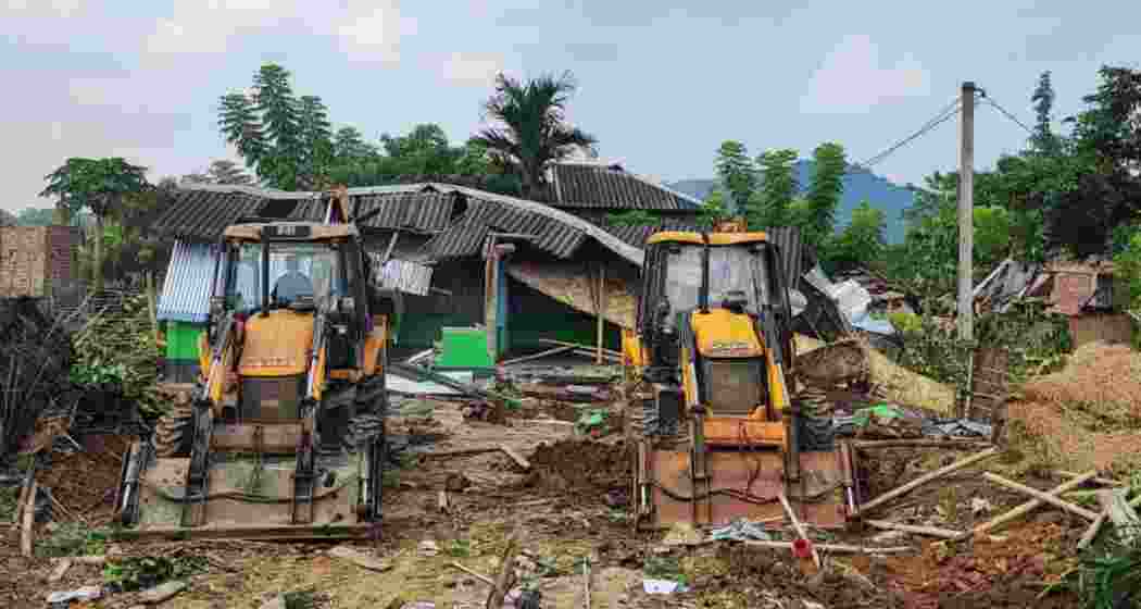 Excavators clear encroached forest land in Goalpara district.