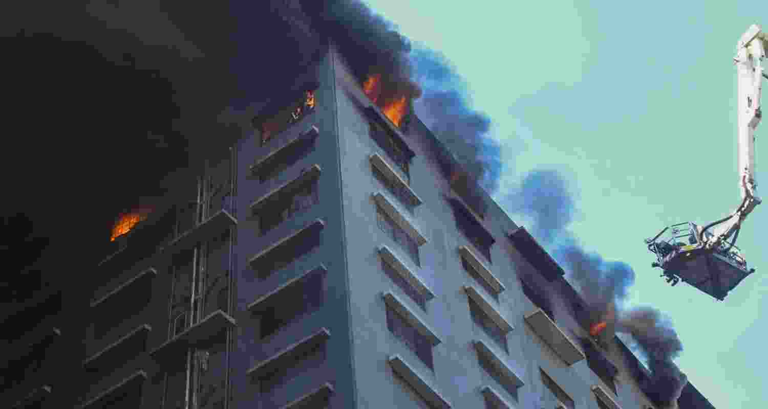 The third, fifth, and top floor of the building are said to have been engulfed in flames, forcing the firefighters to use breathing apparatus to enter the building