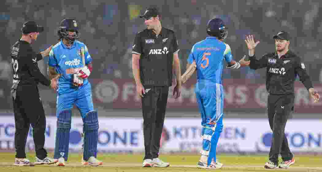 India's KL Rahul and Washington Sundar being congratulated by New Zealand's players after winning the first ODI cricket match of a series between India and New Zealand, at Kotambi Stadium, in Vadodara, Gujarat, Sunday.