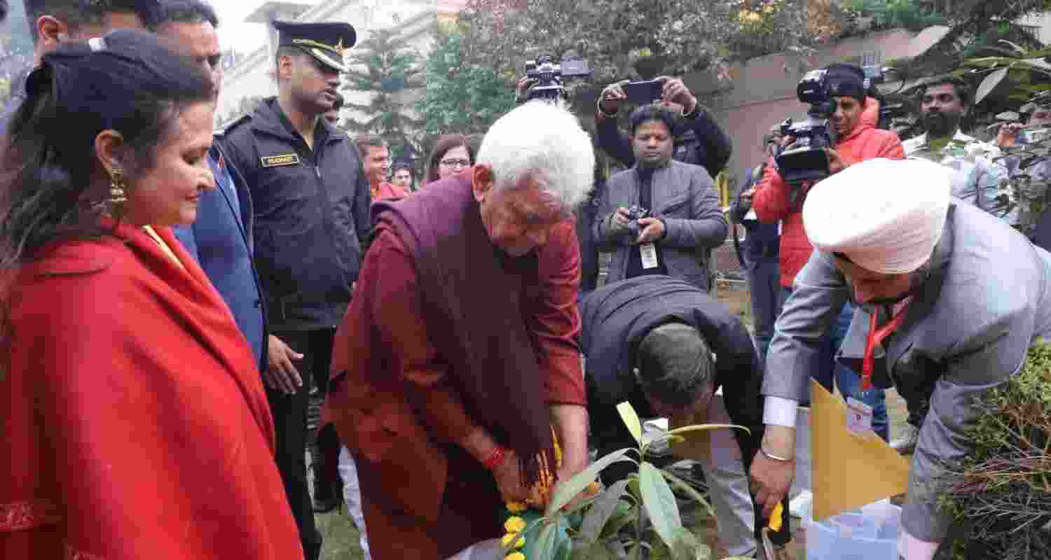 Jammu and Kashmir LG Manoj Sinha planting a ceremonial sapling at the JK House in New Delhi at the JK Sambhaav Diwas
