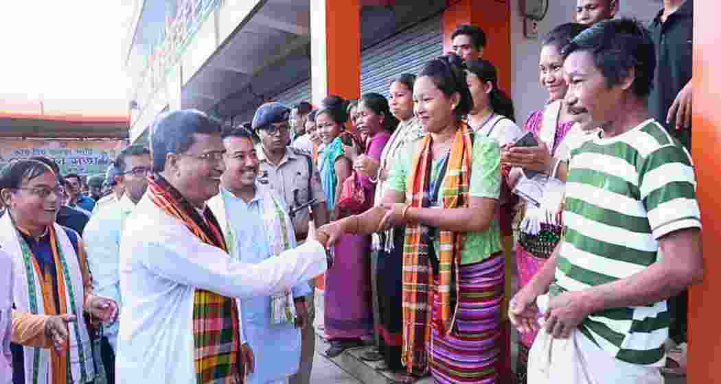 Tripura Chief Minister Manik Saha interacts with members of the tribal community in Gomati district.