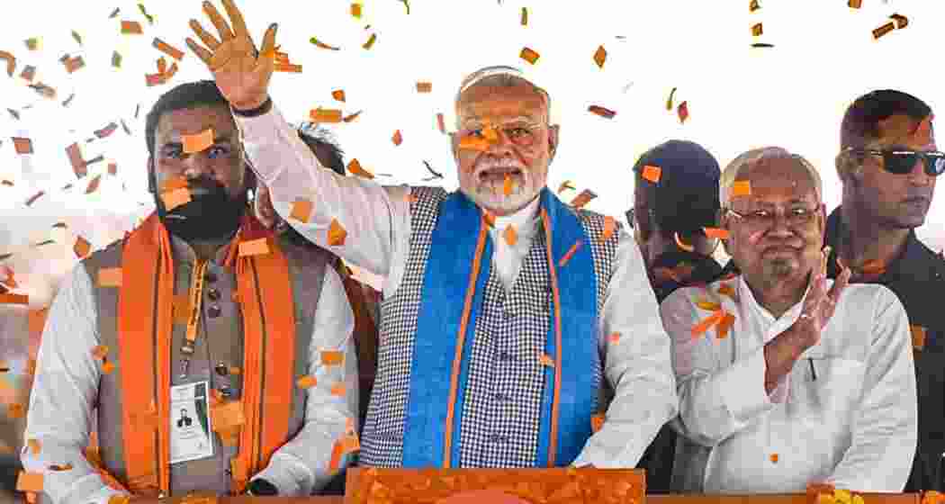 Prime Minister Narendra Modi (centre), Bihar Chief Minister Nitish Kumar (right) and Deputy CM Samrat Choudhary during a public meeting, in Siwan district in June.