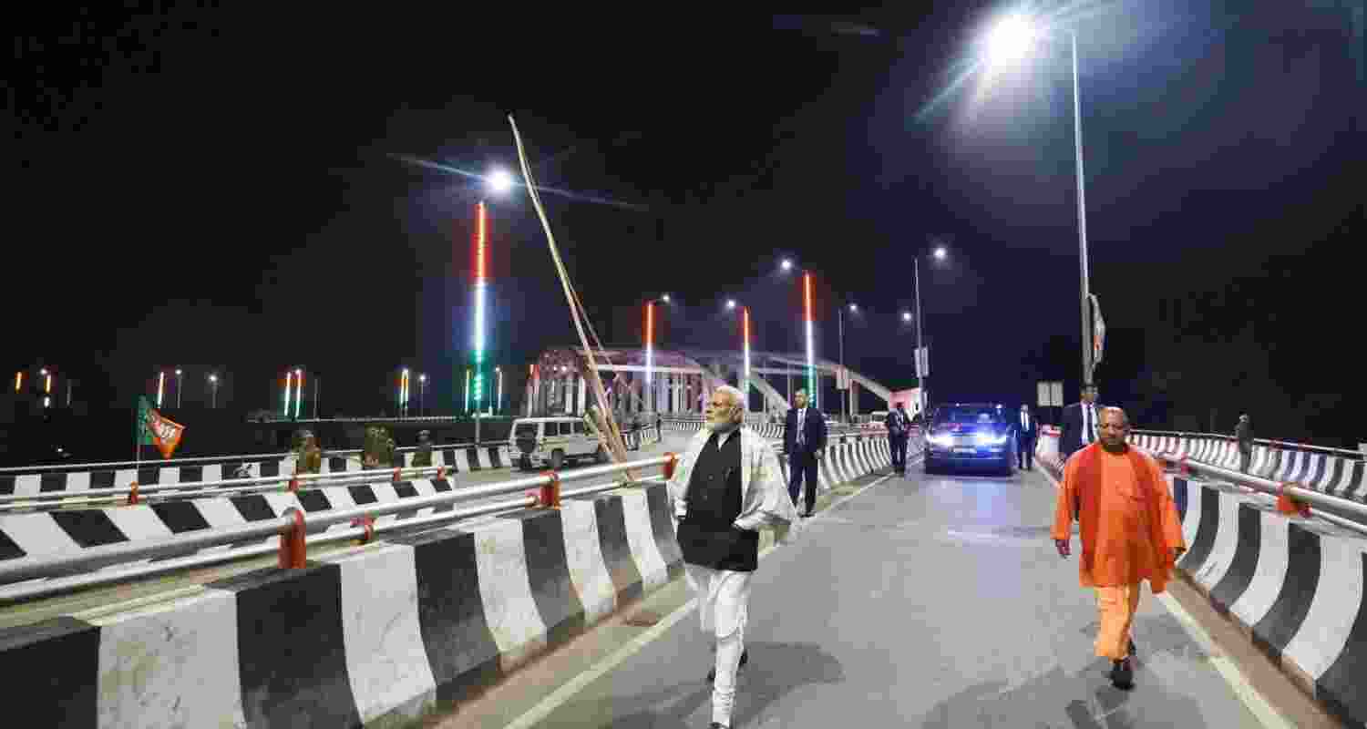 Prime Minister Narendra Modi greets people in his parliamentary constituency, in Varanasi.