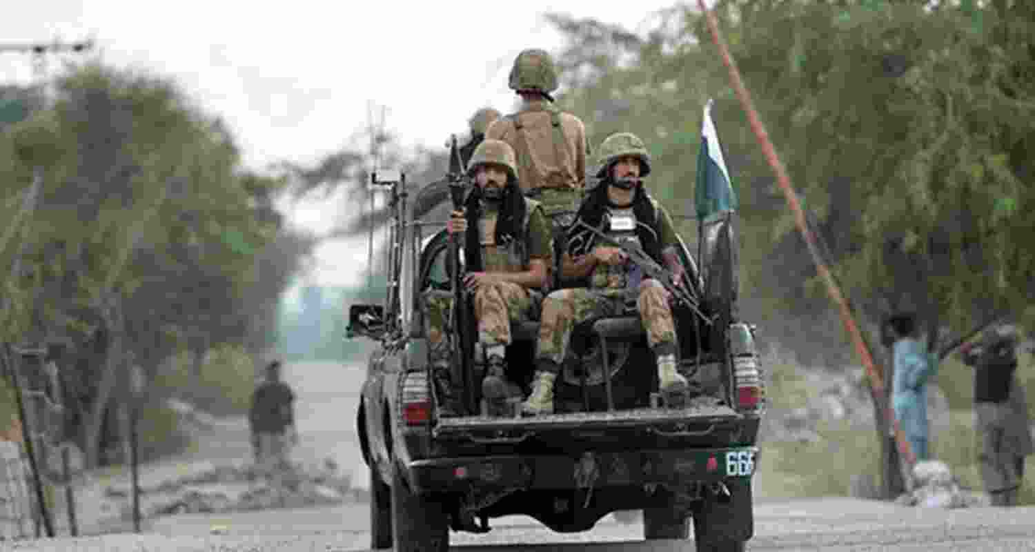 An image of Pakistan Army personnel in a military vehicle.