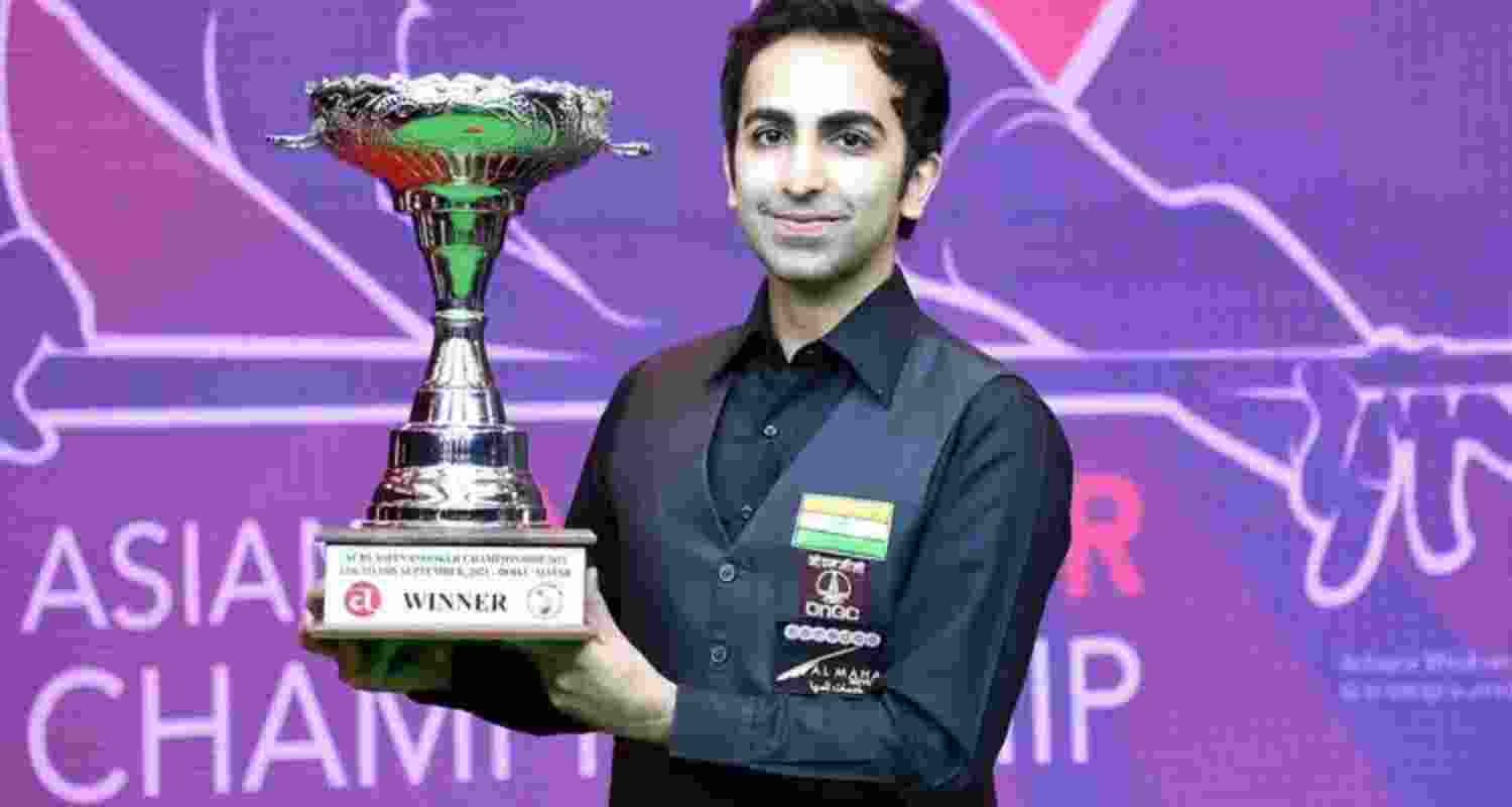 Pankaj Advani posing with the winner's trophy.