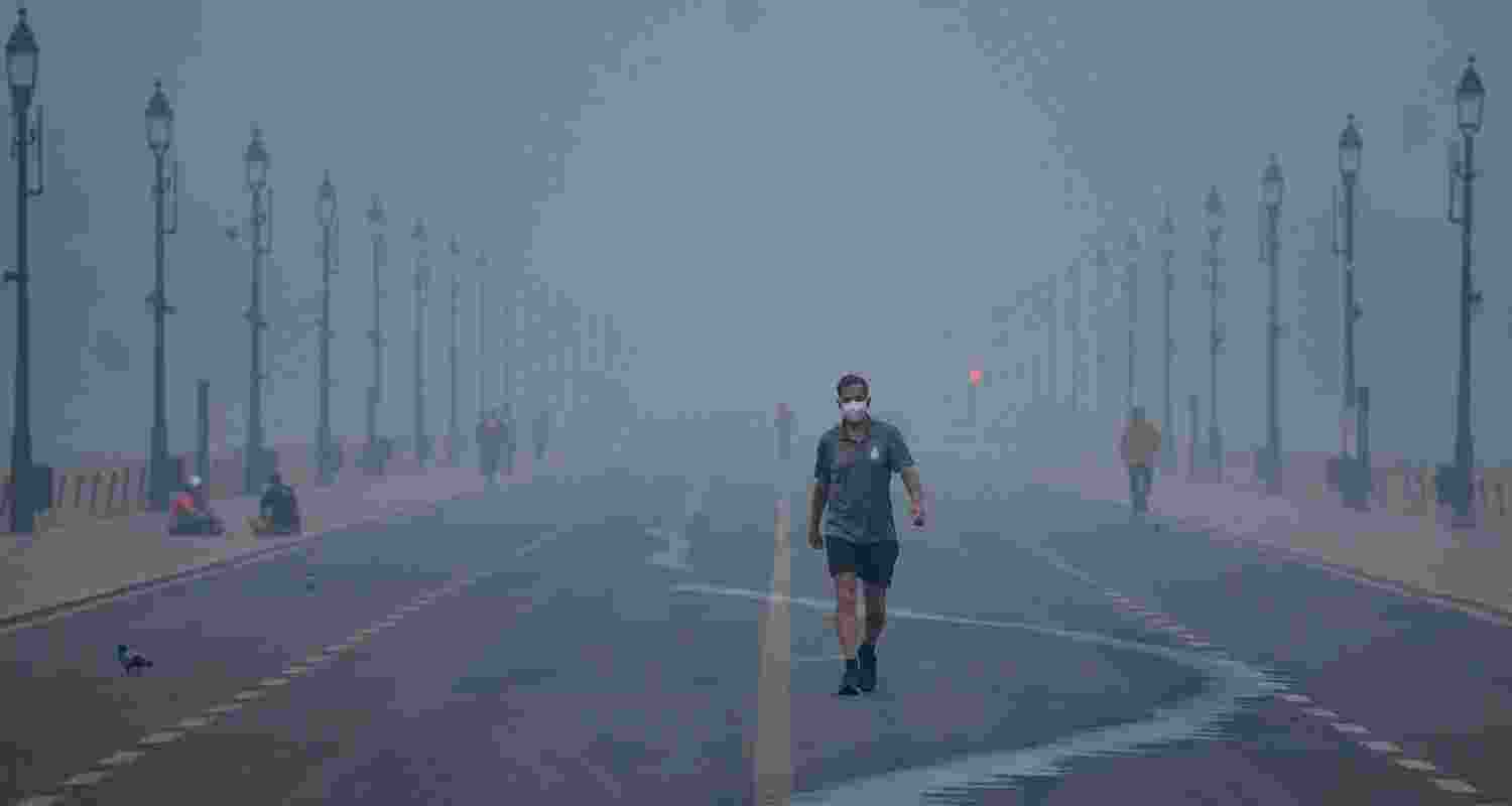 A pedestrian at Kartavya Path amid smog, in New Delhi, Thursday, November 7, 2024.