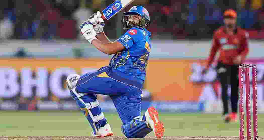 Rohit Sharma plays a commanding shot en route to his 70-run knock, guiding Mumbai Indians to a comprehensive seven-wicket win over Sunrisers Hyderabad in Hyderabad on Wednesday.