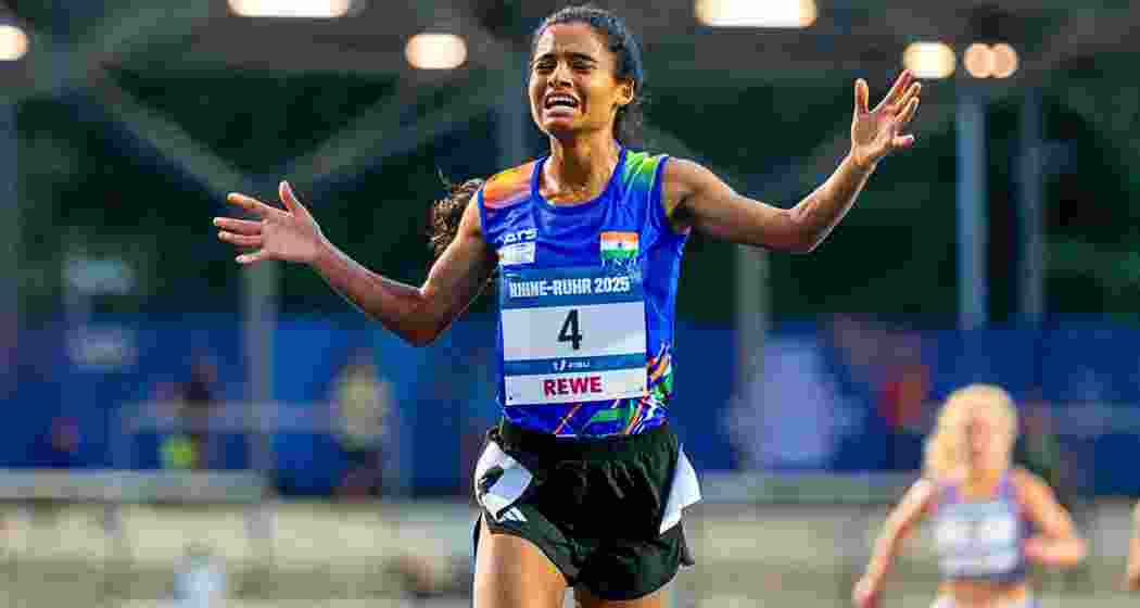 Indian athlete Seema breaks down in tears as she completes the final lap of the 5000m race at the World University Games in Rhine-Ruhr.