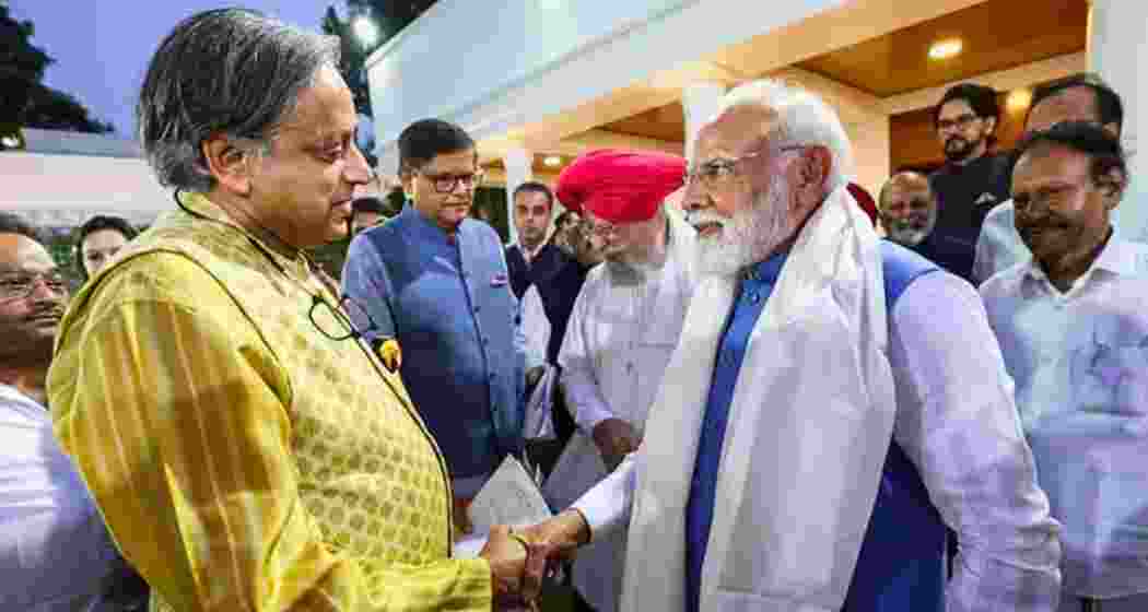 Prime Minister Narendra Modi greets Congress MP Shashi Tharoor. (File photo)
