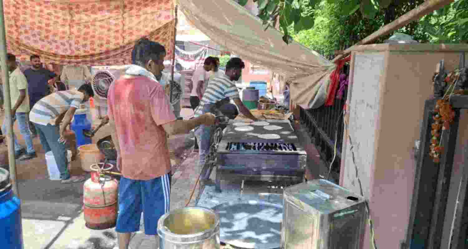 Students at the makeshift kitchen on HAU campus after authorities cut off food and supply to hostels