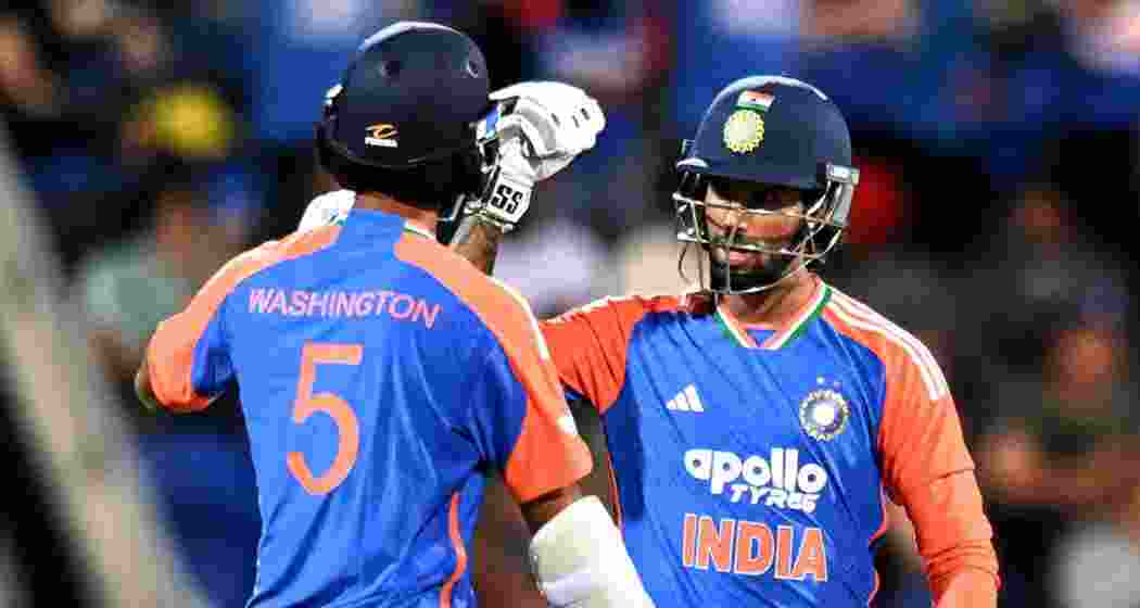 Sundar and Varma celebrate a boundary as they guide India towards victory over Australia in the second T20I. 