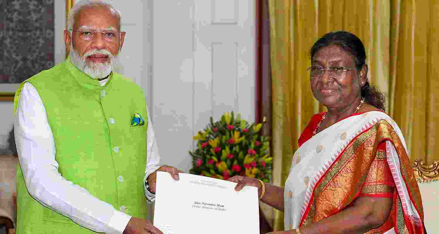 Prime Minister Narendra Modi tenders his resignation letter to President Droupadi Murmu as the 17th Lok Sabha comes to an end, at Rashtrapati Bhavan, in New Delhi on Wednesday.