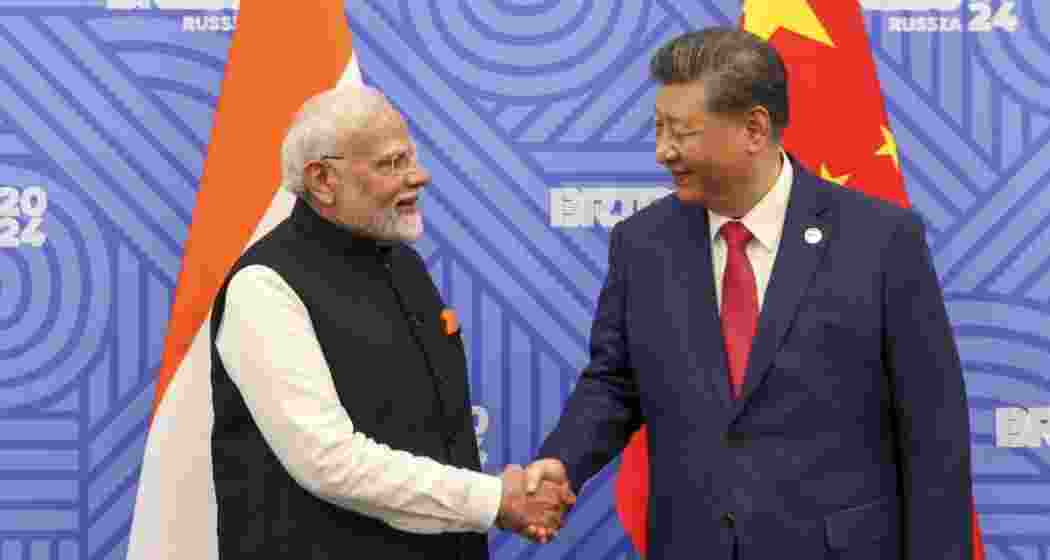 Chinese President Xi Jinping greets Prime Minister Narendra Modi on the sidelines of the BRICS summit in Kazan, Russia.