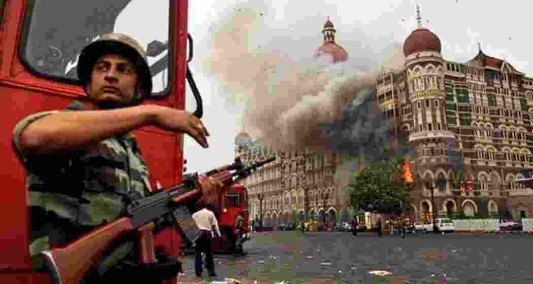 Smoke is seen billowing out of the ground and first floor of the Taj Hotel in south Mumbai following the 26/11 terror attacks in 2008. (File photo)