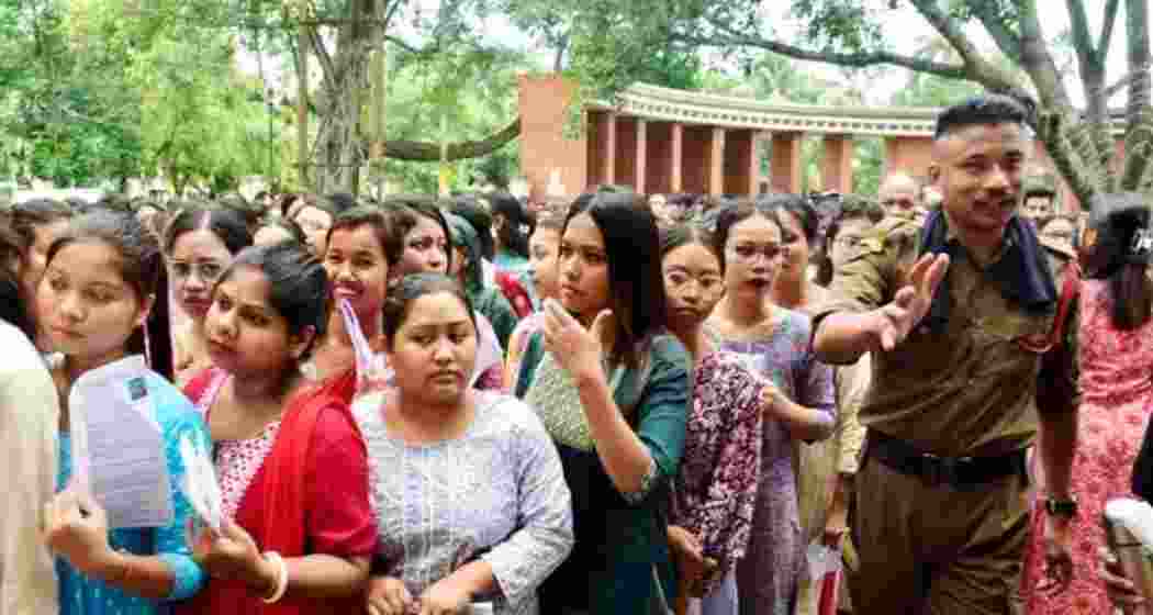 Aspiring candidates of Assam Direct Recruitment Examination (ADRE) wait to enter an examination hall to appear in the examination for the Assam Government Grade-3 jobs, in Guwahati, Sunday, Sept. 15, 2024.