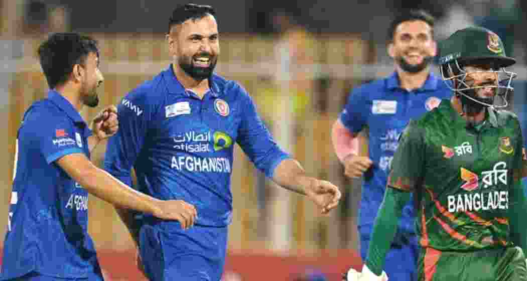 Afghanistan players celebrate a wicket against Bangladesh. 