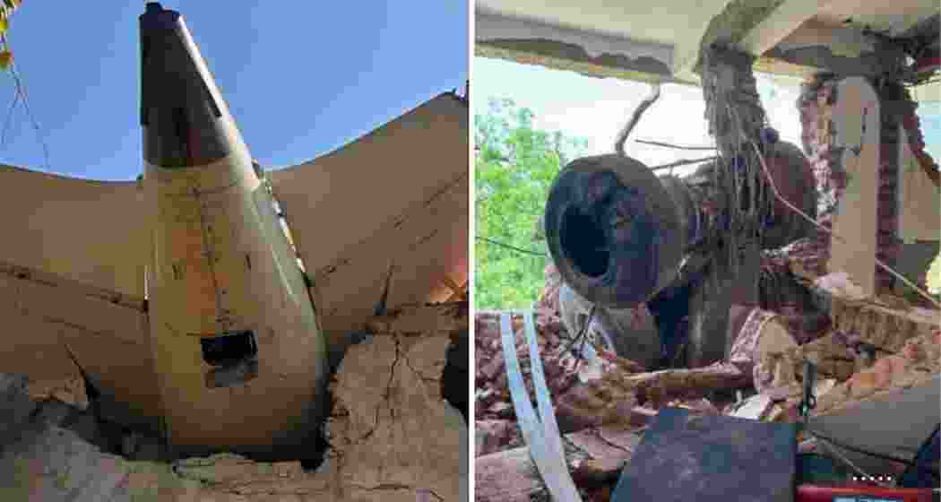Wreckage of the Air India Dreamliner hangs from the hostel wall, with landing gear lodged in the debris, after the aircraft crashed seconds post takeoff in Ahmedabad on June 12