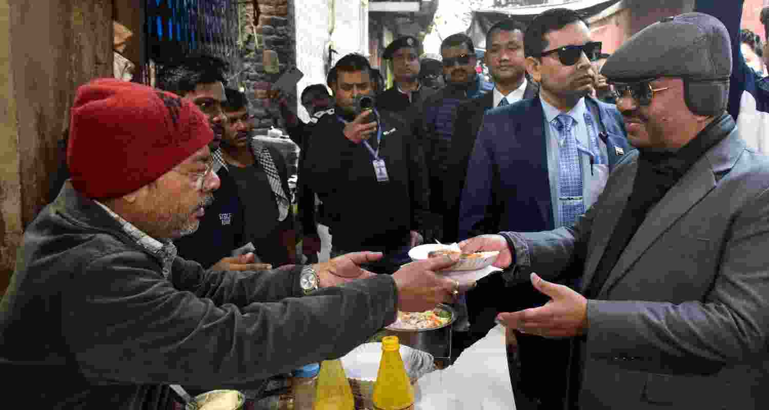 West Bengal Governor CV Ananda Bose interacts with food stall owners.