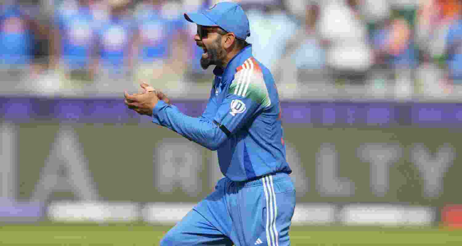 Indian player Virat Kohli wears a black armband during the semi-final match against Australia.