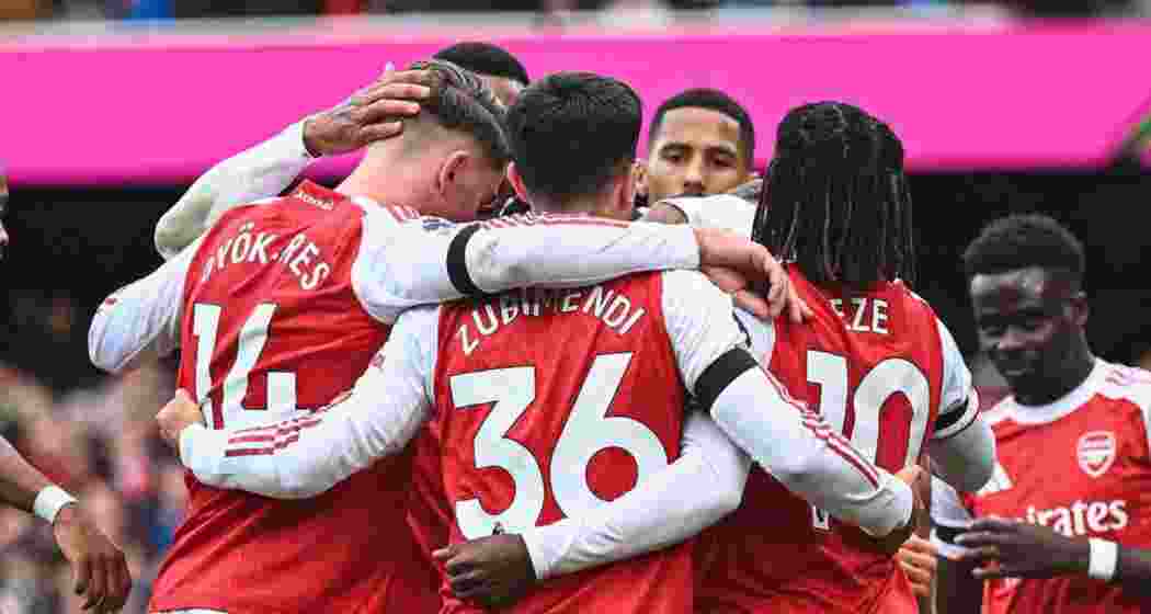 Arsenal players celebrate their win.