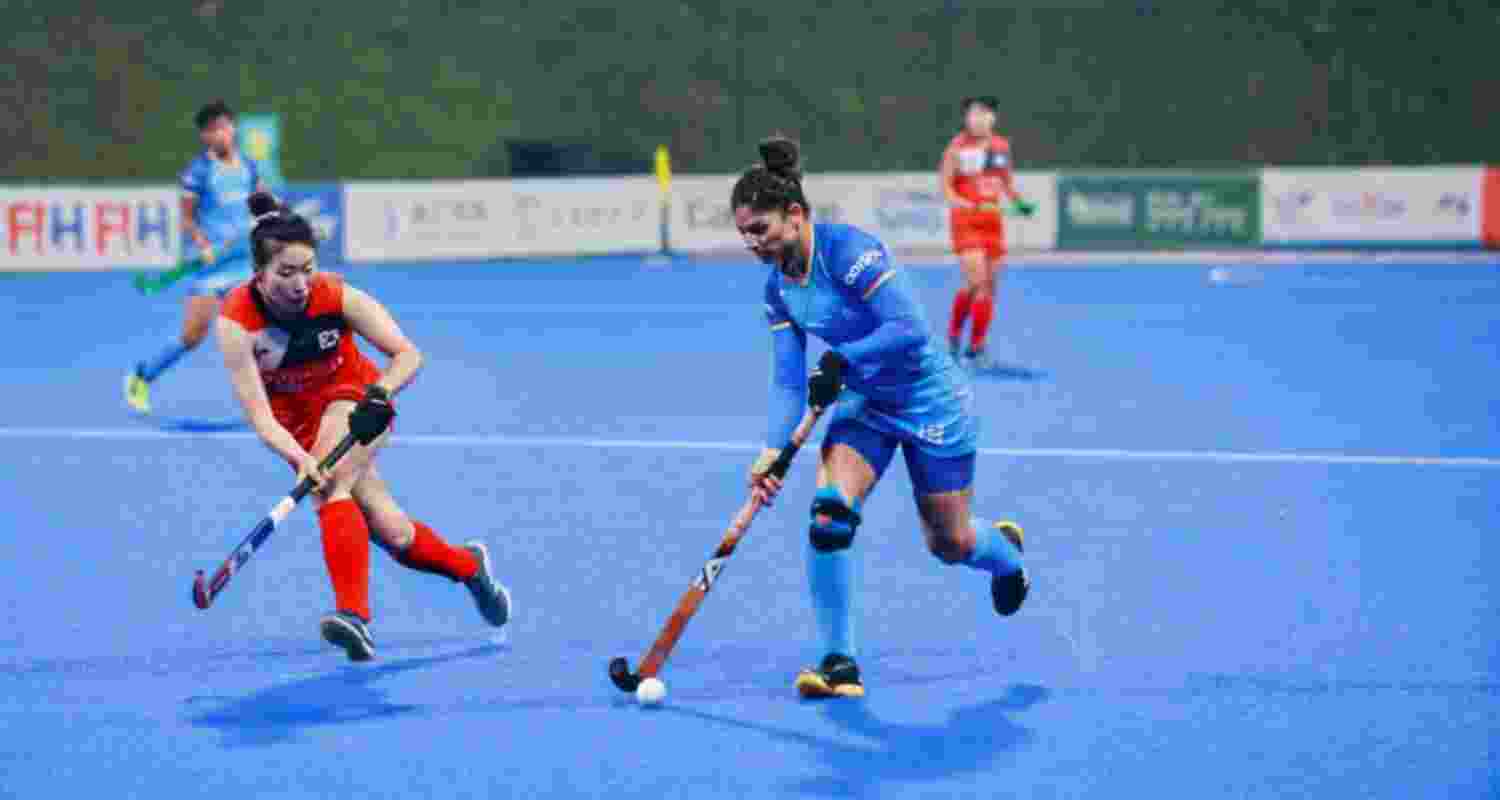 An Indian midfielder dribbling past the Korean defence during India's first Super 4 match of the Asia Cup women's hockey tournament.
