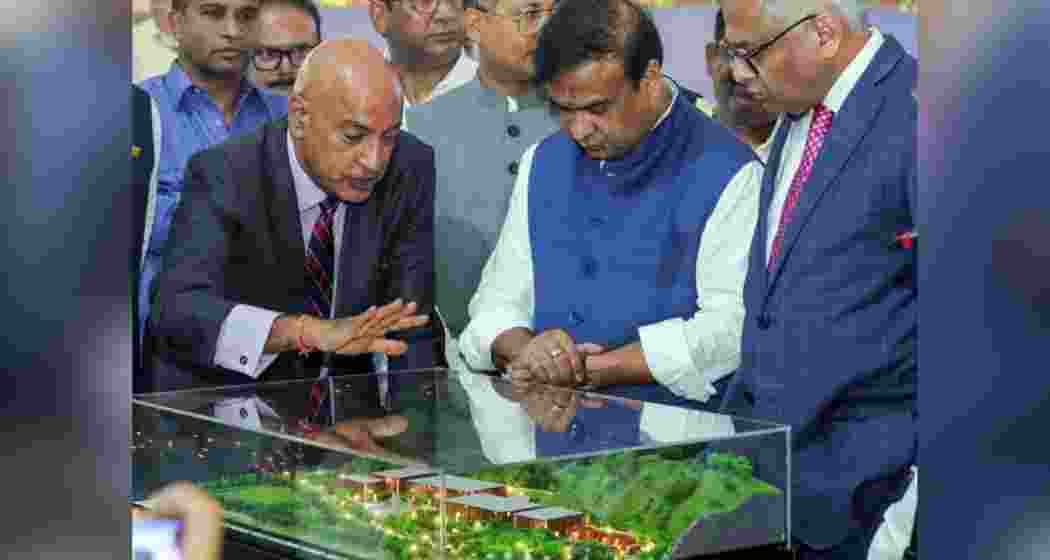 Assam CM Himanta Biswa Sarma and Tata Sons Chairman N Chandrasekaran inspect a replica model of the semiconductor plant in Jagiroad, Morigaon district.