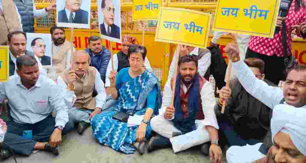 LoP Atishi along with AAP MLAs staging a protest outside the Delhi Assembly session on Thursday, February 27, 2025.