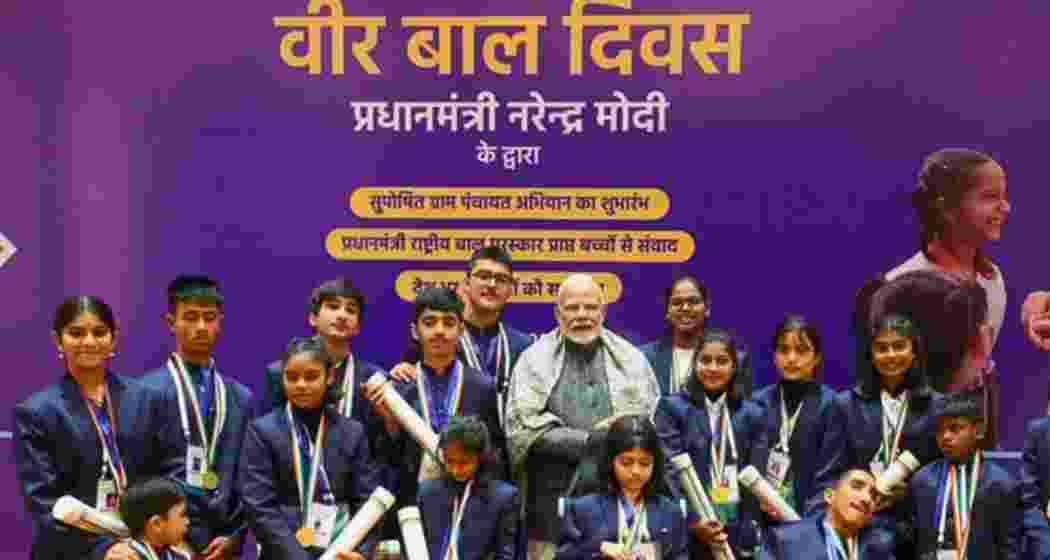 Prime Minister Narendra Modi poses with children during a Pradhan Mantri Rashtriya Bal Puraskar function in New Delhi. Prime Minister Narendra Modi poses with children during a Pradhan Mantri Rashtriya Bal Puraskar function in New Delhi.