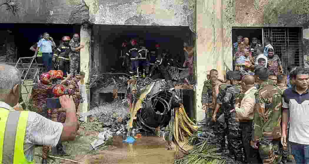 Emergency personnel conduct search and rescue at Milestone School, Dhaka, after an Air Force jet crashed, killing at least 20 and injuring over 170, including school students. 
