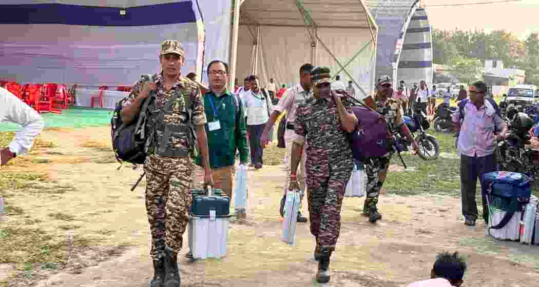 Polling parties and security personnel depart for their assigned booths with EVMs and election materials after collecting them from designated despatch centres ahead of the first phase of polling.