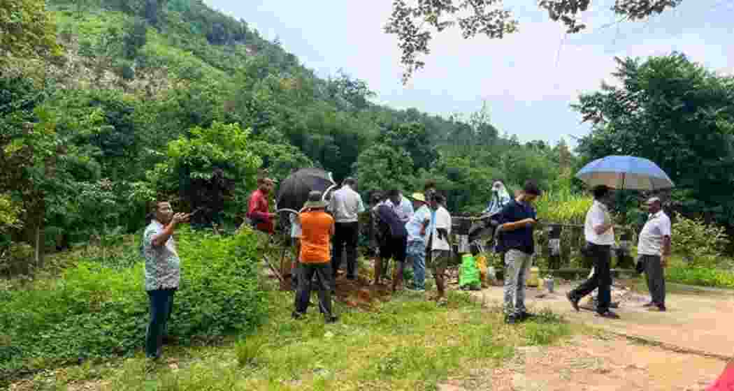 Survey teams from Assam and Meghalaya install boundary pillars at Rongthali village in Hahim on Tuesday.