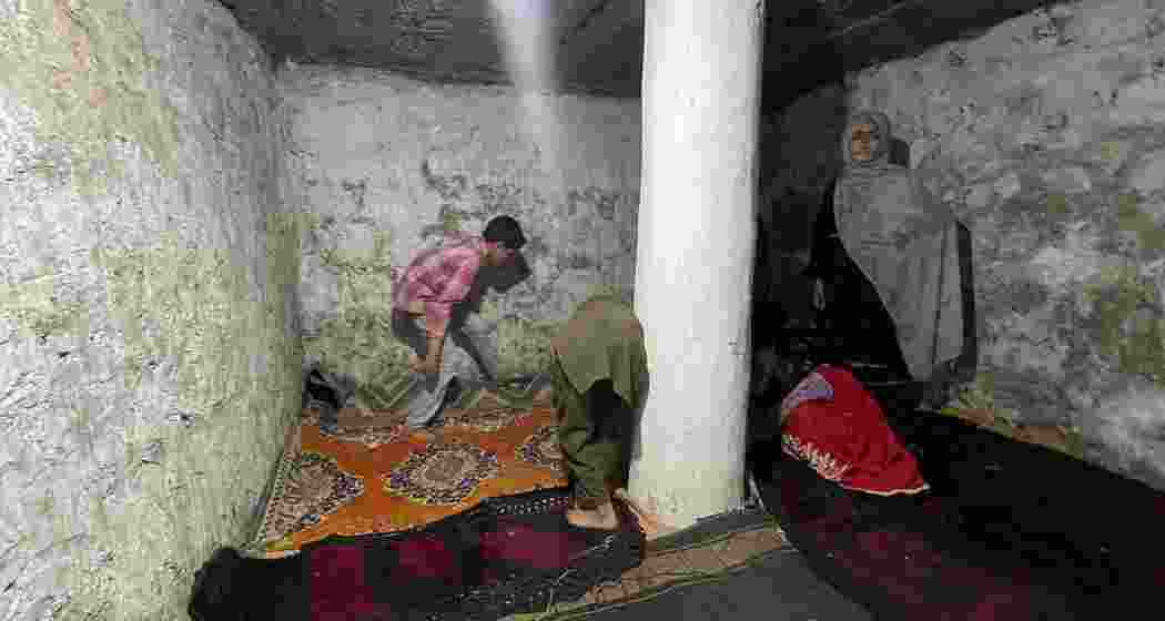 A family lays carpets in a bunker in Chakothi, 3km from the LoC, as cross-border tensions continue to escalate.