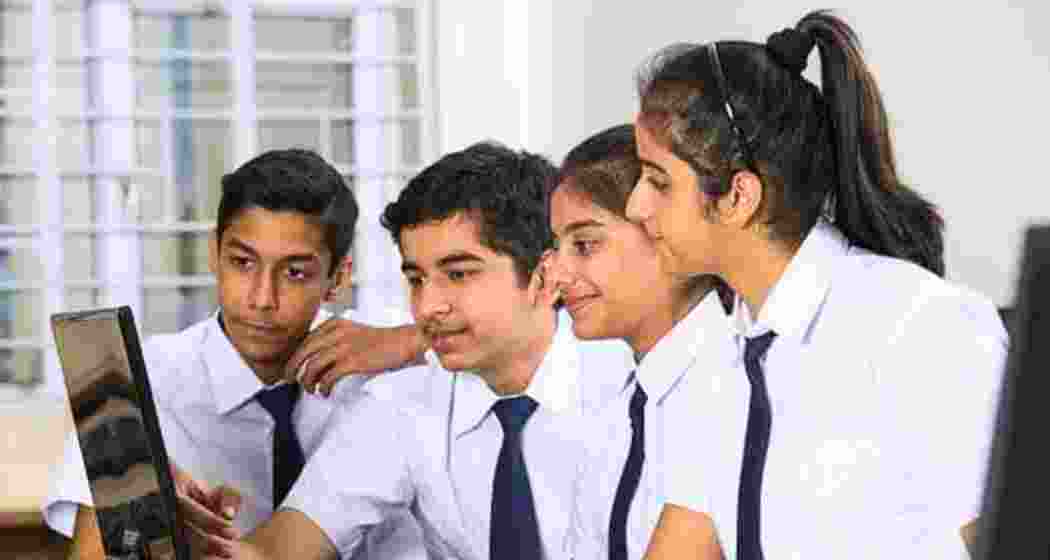 Students work on a PC during a classroom session.