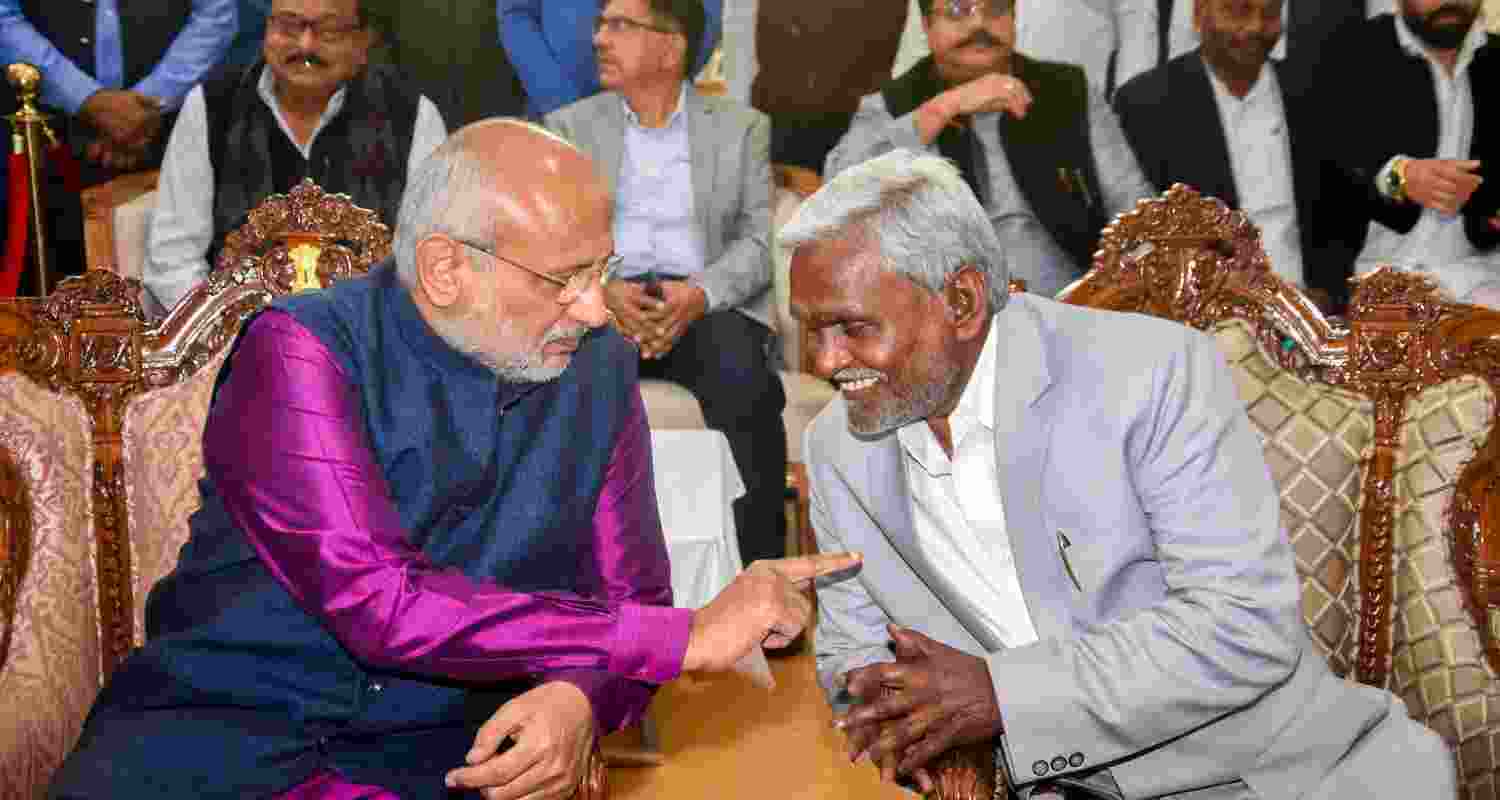 CM Champai Soren and Governor CP Radhakrishnan engaged in a conversation at the cabinet oath-taking program.