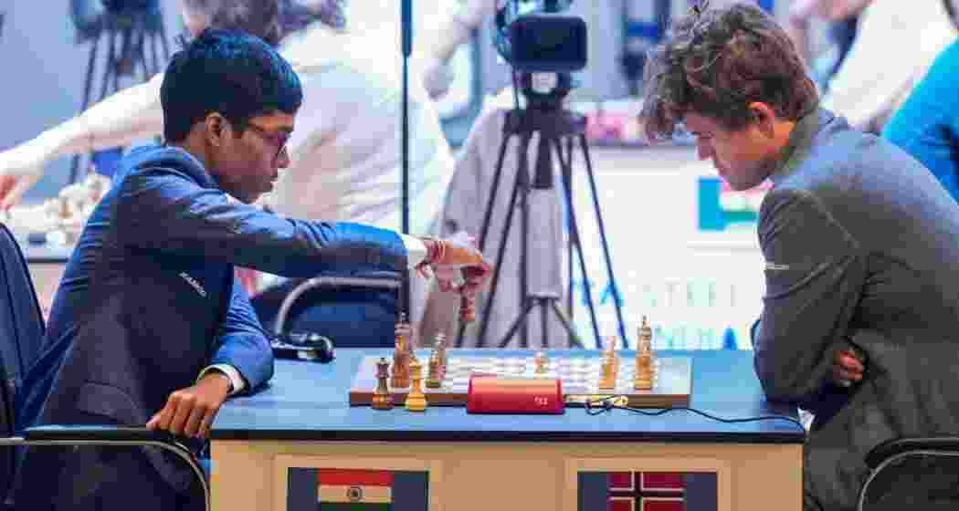 Five-time world chess champion Magnus Carlsen of Norway and Indian Grandmaster R Pragganandhaa on the Day 1 of Tata Steel Chess India Rapid, in Kolkata, Wednesday.