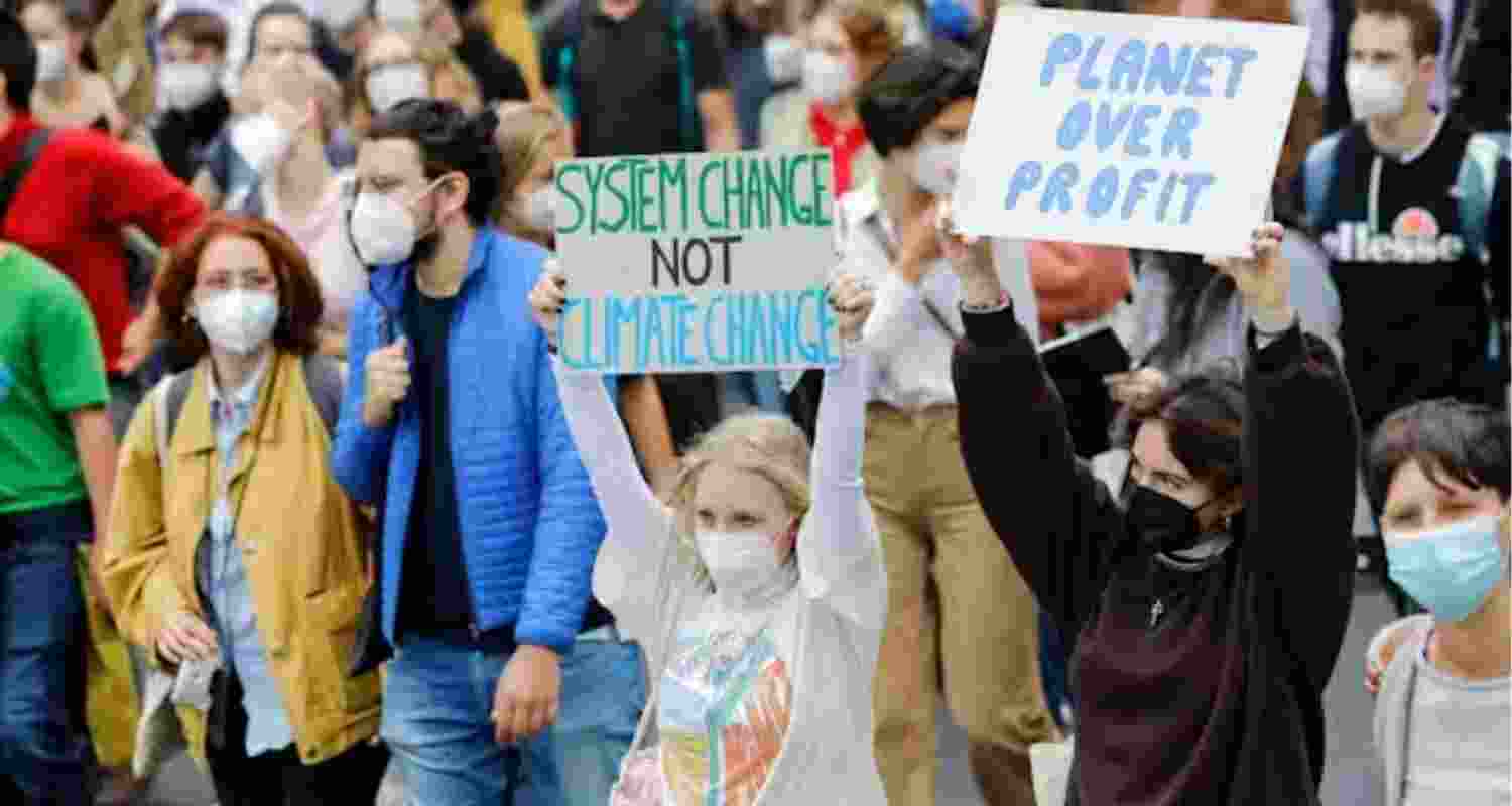 udents march as part of the Fridays for Future climate movement protest in Vienna, Austria in September 2021.