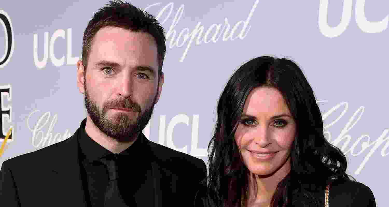 Musician Johnny McDaid and actress Courteney Cox. Musician Johnny McDaid and actress Courteney Cox.