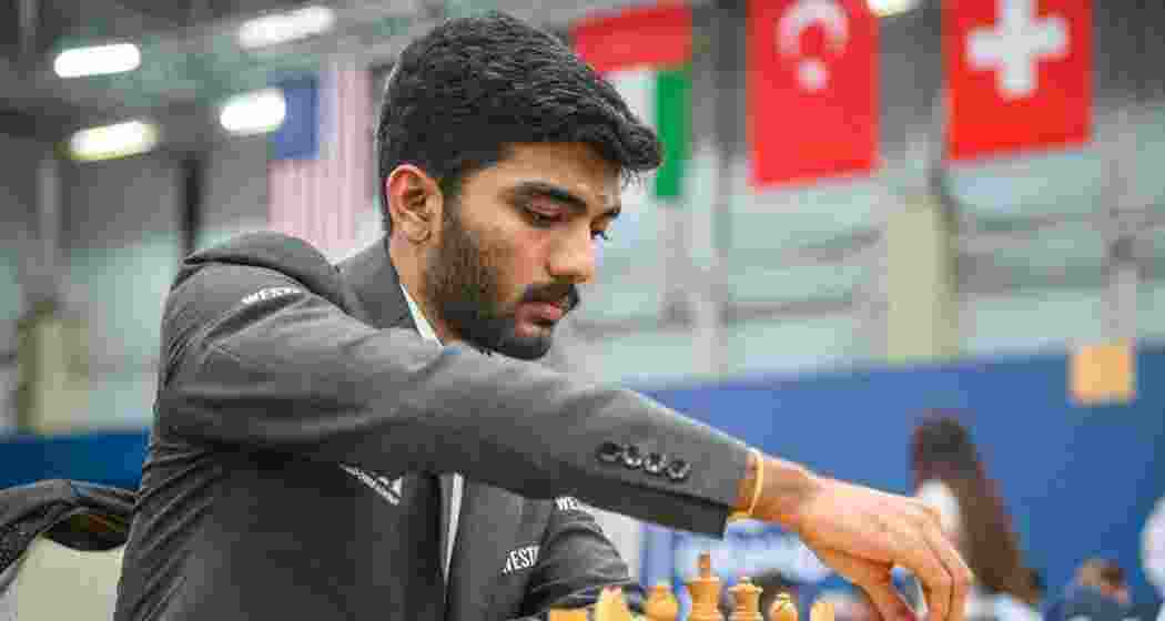 D Gukesh plays a move during a game.