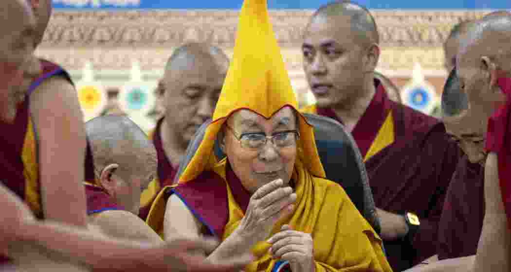 Tibetan spiritual leader the Dalai Lama (C) arrives to attend a Long Life Prayer offering ceremony at the Main Tibetan Temple in McLeod Ganj, near Dharamsala on June 30, 2025.