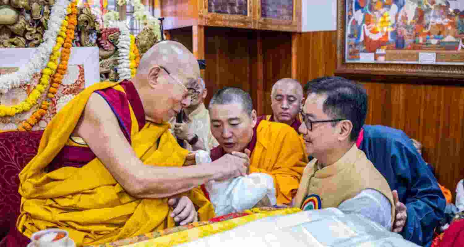 Union Minister Kiren Rijiju with Tibetan spiritual leader the Dalai Lama during a long life prayer ceremony for the latter on the eve of his 90th birth anniversary, at McLeodganj, in Kangra district, Himachal Pradesh.