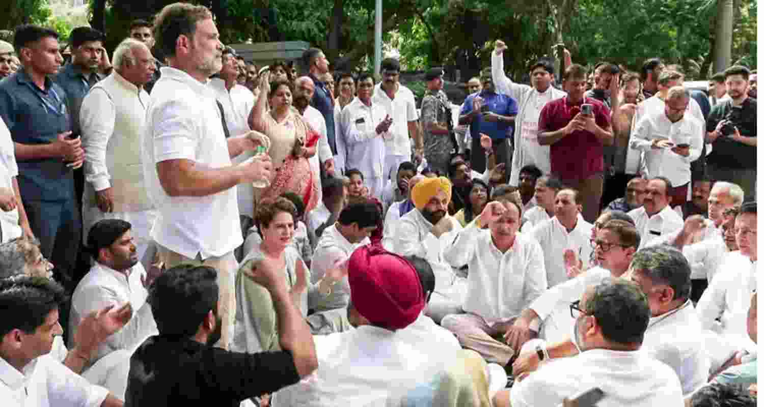 Congress leader Rahul Gandhi, party president Malikarjun Kharge and Congress MP Priyanka Gandhi staging a sit-in outside the PM's residence in New Delhi on Tuesday. Congress leader Rahul Gandhi, party president Malikarjun Kharge and Congress MP Priyanka Gandhi staging a sit-in outside the PM's residence in New Delhi on Tuesday.